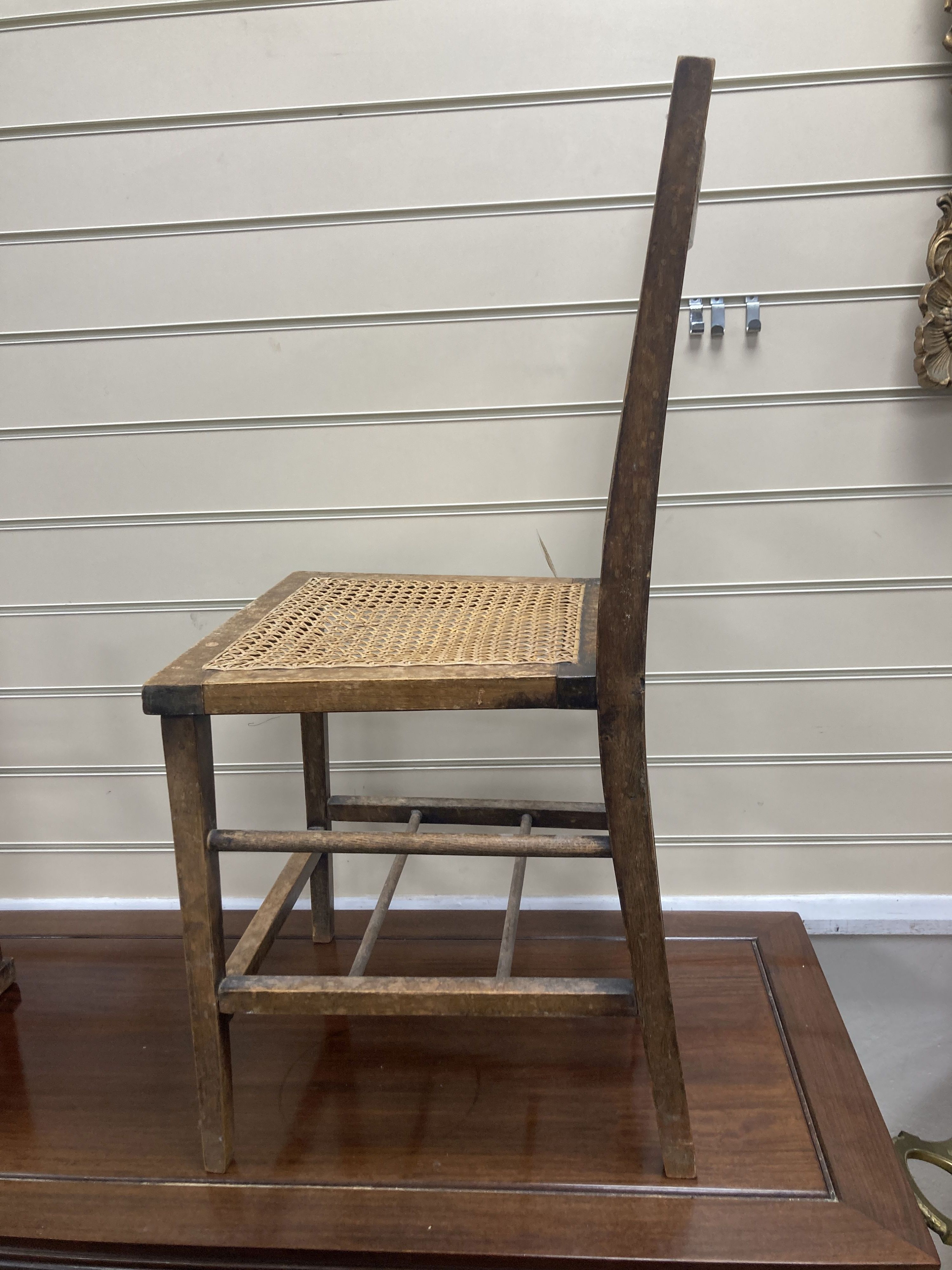 A pair of George V Coronation chairs stamped with Royal Cypher